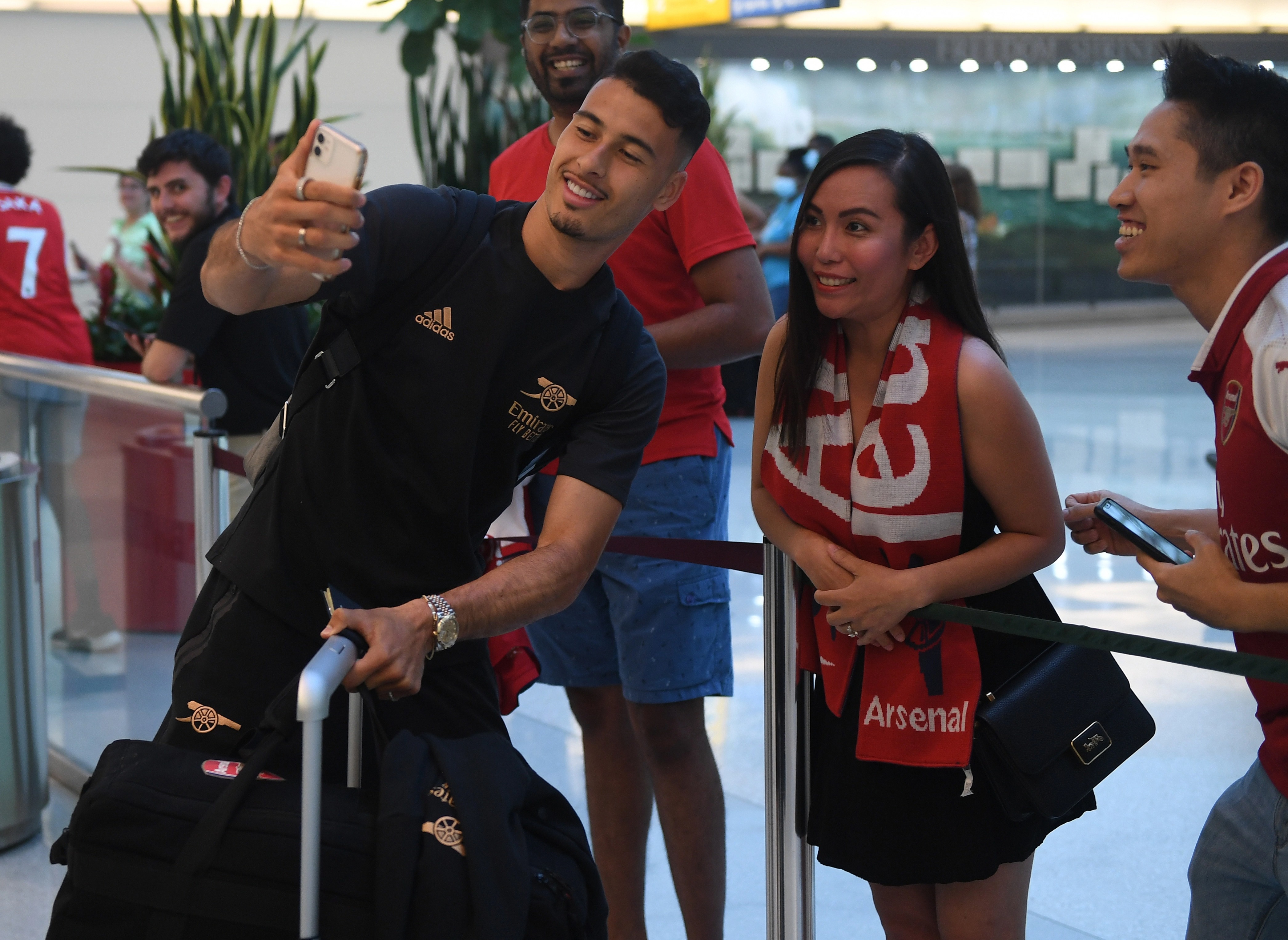 The Arsenal players were mobbed by fans after landing in America